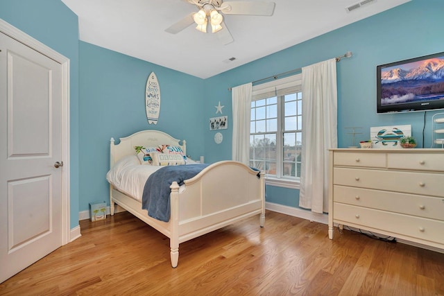 bedroom with ceiling fan and light wood-type flooring