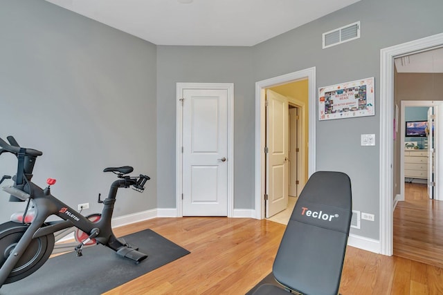 exercise room featuring hardwood / wood-style flooring