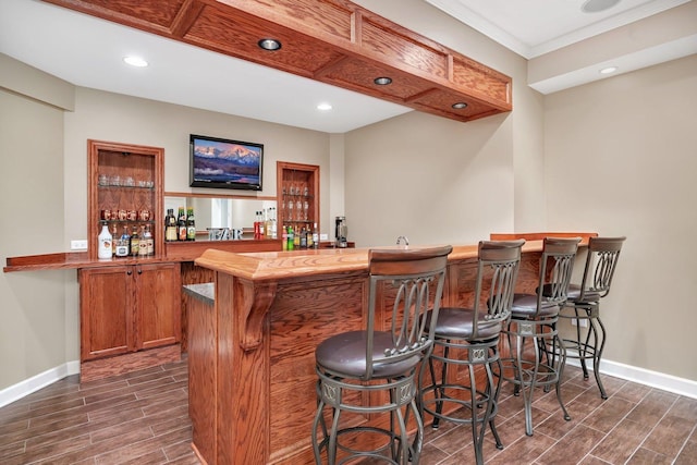 bar featuring crown molding