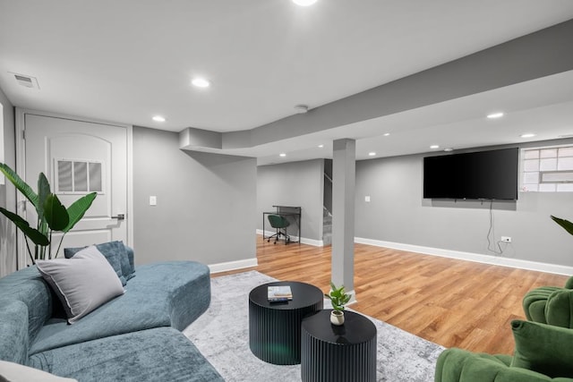 living room with light hardwood / wood-style flooring