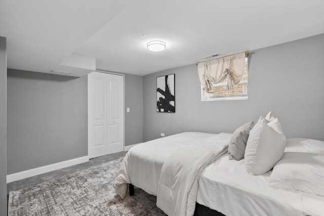 carpeted bedroom with a closet