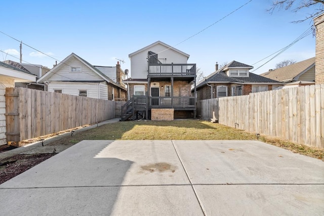 view of yard featuring a patio and a balcony