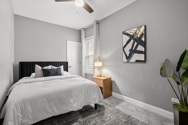 bedroom with ceiling fan and carpet floors