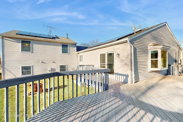 wooden terrace with a yard