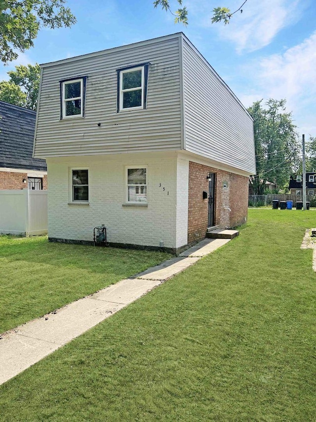 view of property exterior with a lawn