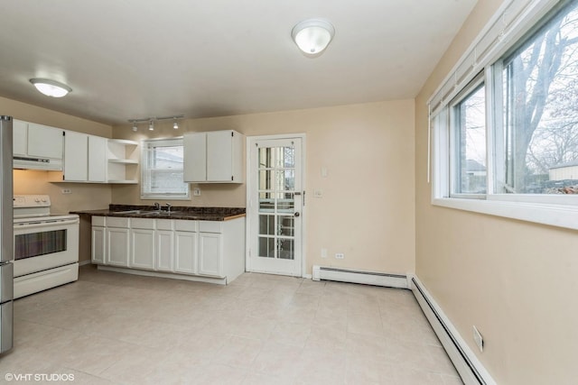 kitchen with electric stove, sink, white cabinetry, and baseboard heating