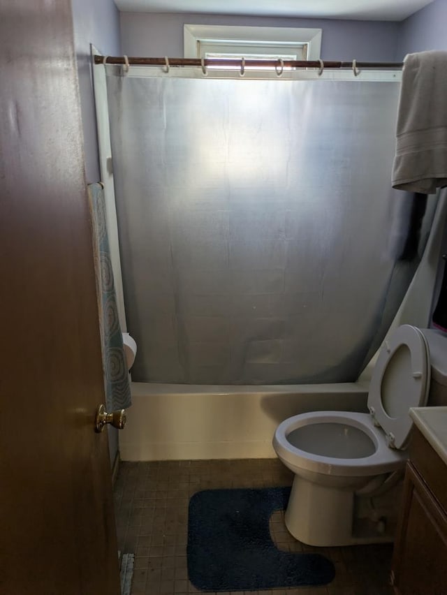 bathroom featuring vanity, toilet, and a shower with shower curtain