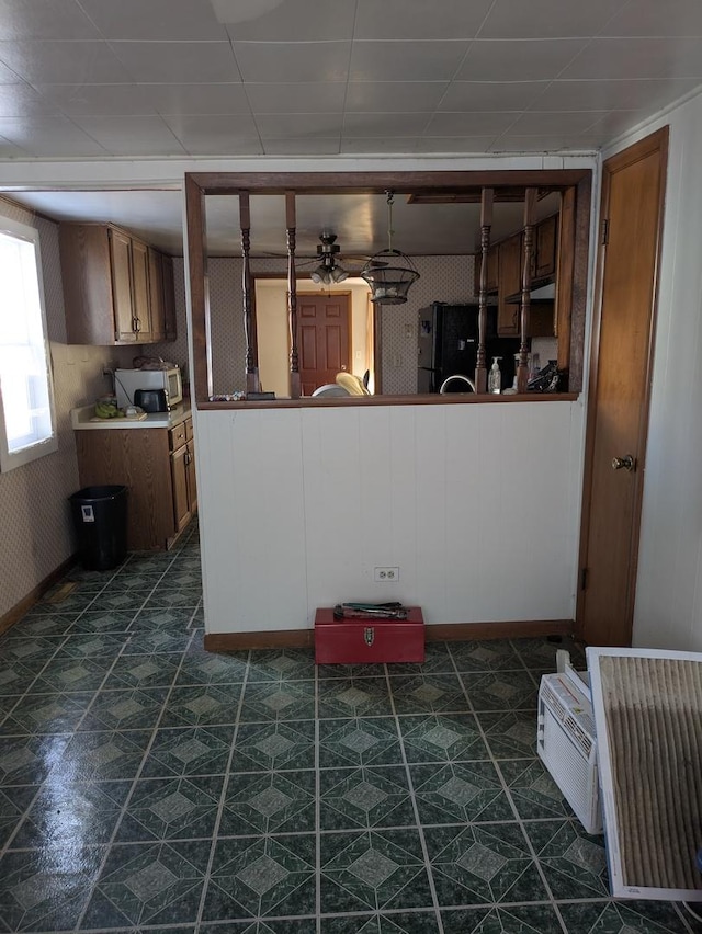 kitchen featuring black refrigerator