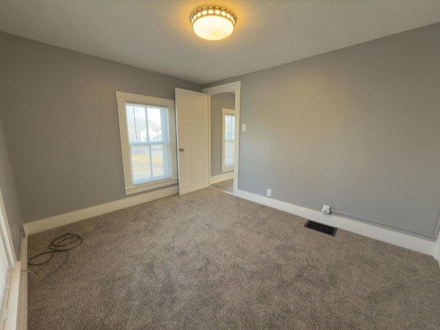 spare room with carpet flooring