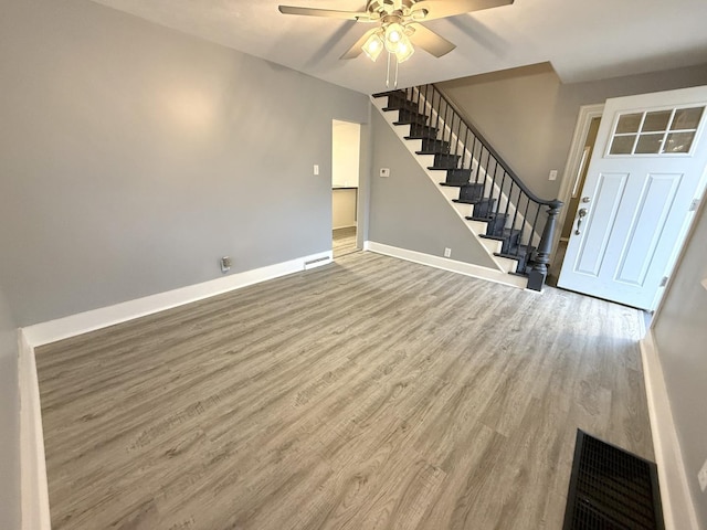 interior space with hardwood / wood-style flooring and ceiling fan