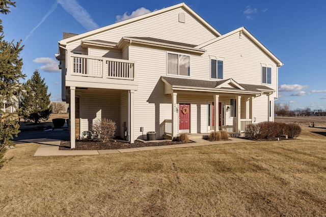 view of front of home with a porch, a balcony, a front lawn, and central air condition unit