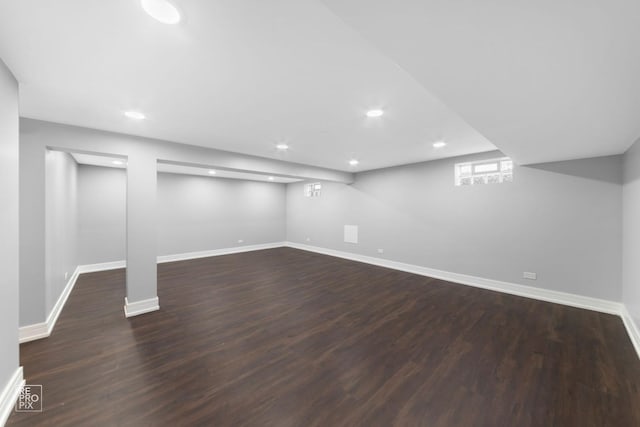 basement featuring dark wood-type flooring