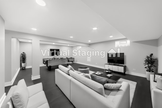 living room featuring dark wood-type flooring