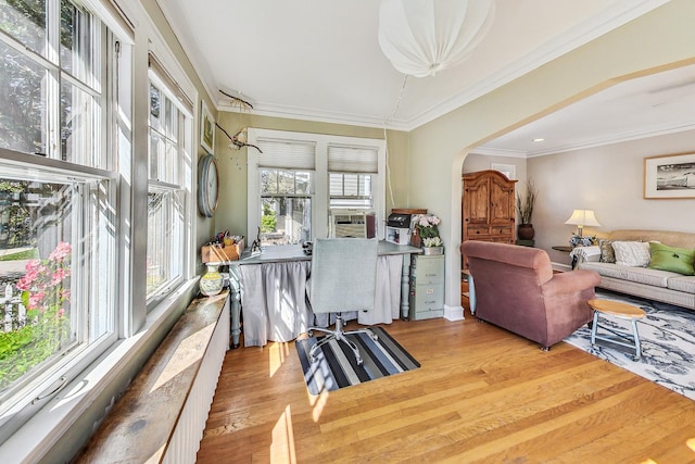 interior space with crown molding and light wood-type flooring