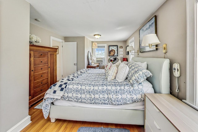 bedroom with light hardwood / wood-style flooring