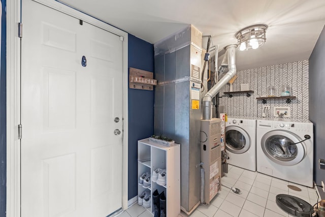 clothes washing area featuring light tile patterned flooring and hookup for a washing machine