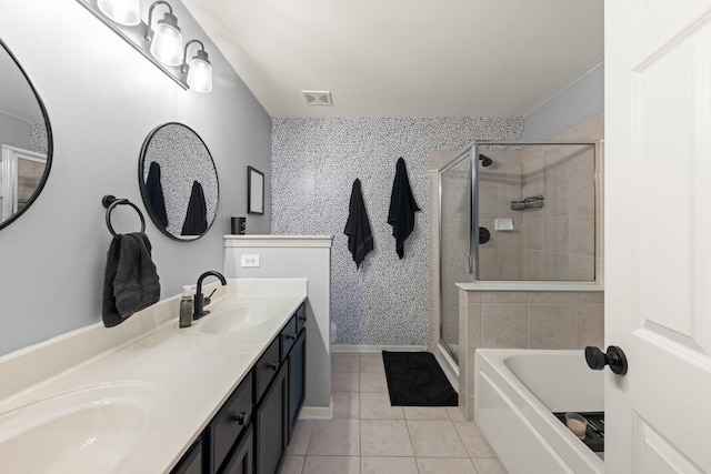 bathroom featuring tile patterned floors, independent shower and bath, and vanity