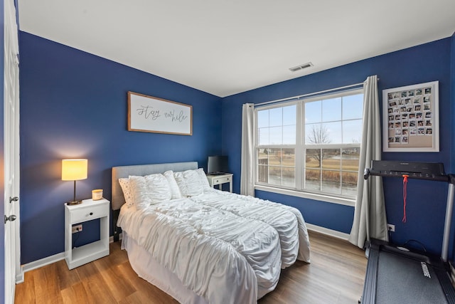 bedroom featuring hardwood / wood-style flooring