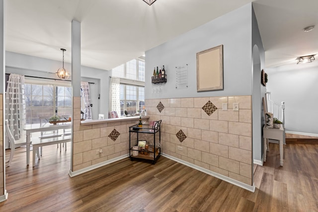 kitchen featuring hardwood / wood-style floors and a chandelier