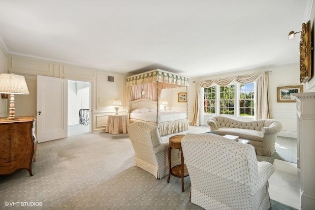 bedroom featuring crown molding and light colored carpet