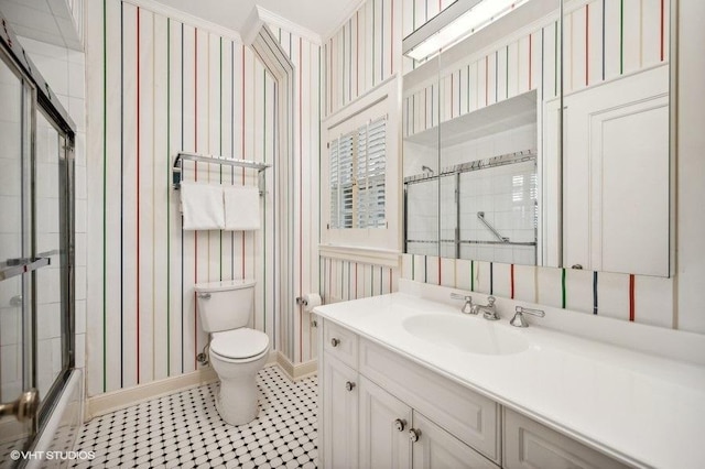 full bathroom featuring bath / shower combo with glass door, vanity, and toilet