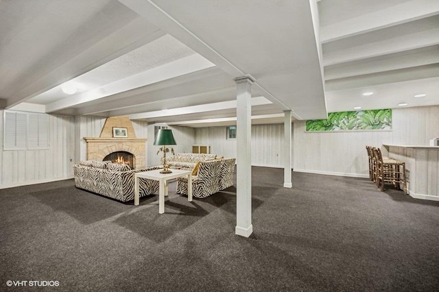 dining room featuring beamed ceiling, indoor bar, and a fireplace