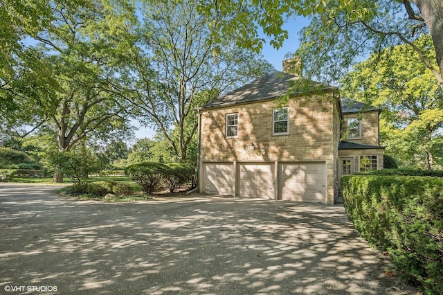 view of side of property featuring a garage