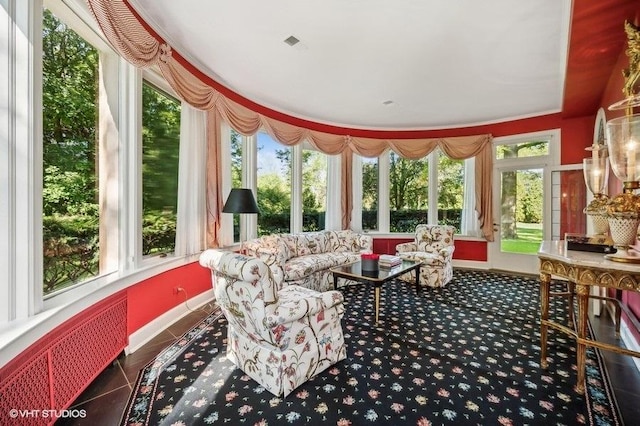 sunroom with radiator heating unit