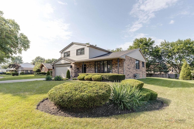 view of front of home featuring a garage and a front yard