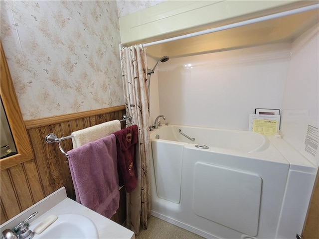 bathroom featuring a bath and sink