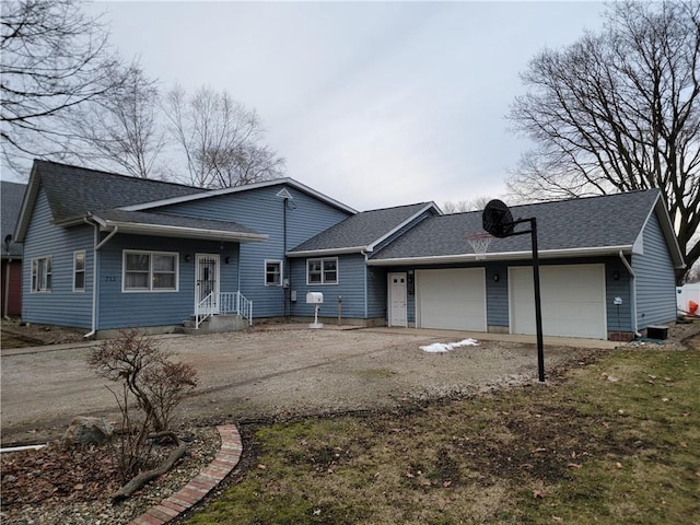 back of house featuring a garage