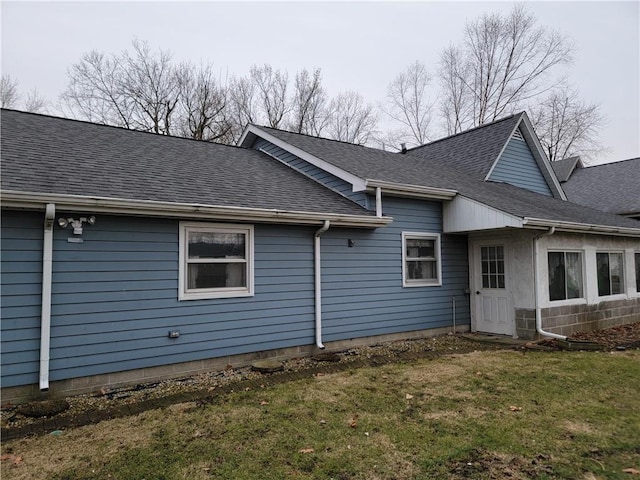 view of side of property with a yard