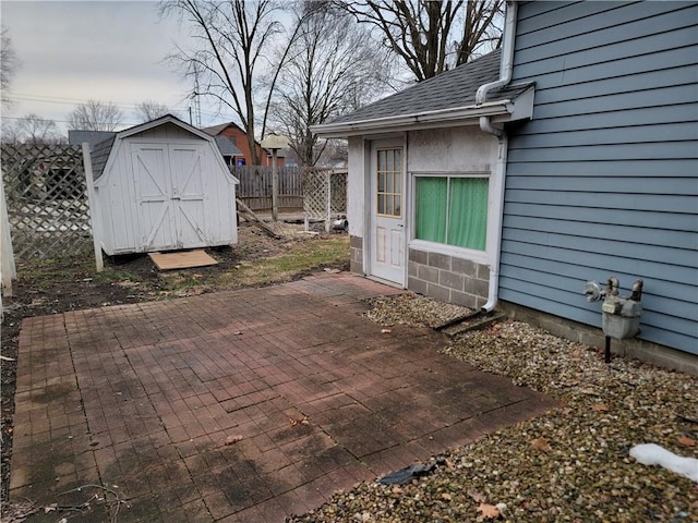 view of patio featuring a storage unit