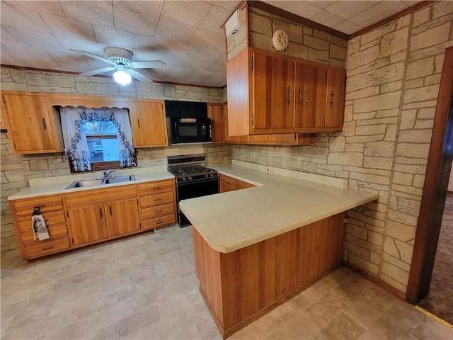 kitchen with black appliances, sink, decorative backsplash, ceiling fan, and kitchen peninsula