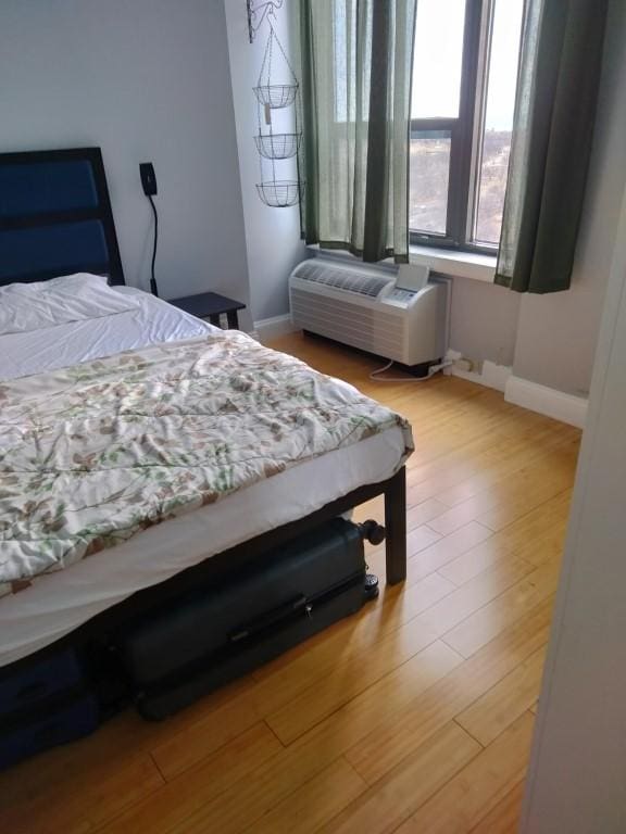 bedroom with light wood-type flooring