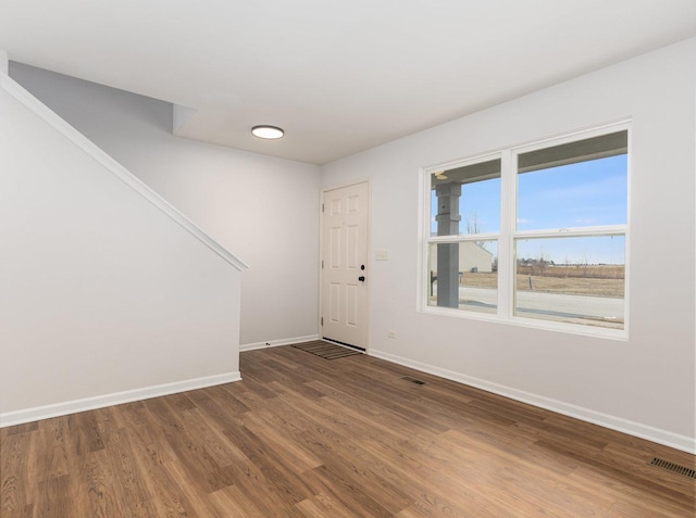 foyer entrance featuring hardwood / wood-style floors