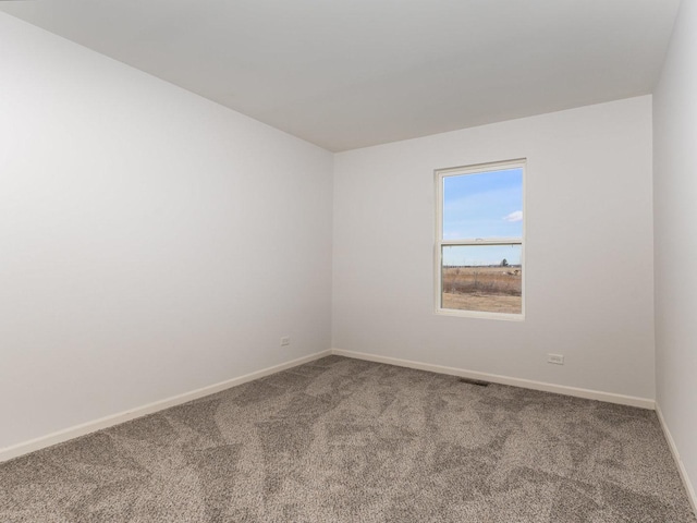 unfurnished room featuring carpet flooring