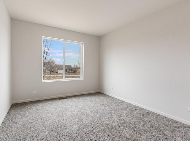 unfurnished room with carpet