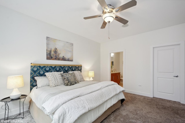 carpeted bedroom with ceiling fan and ensuite bathroom