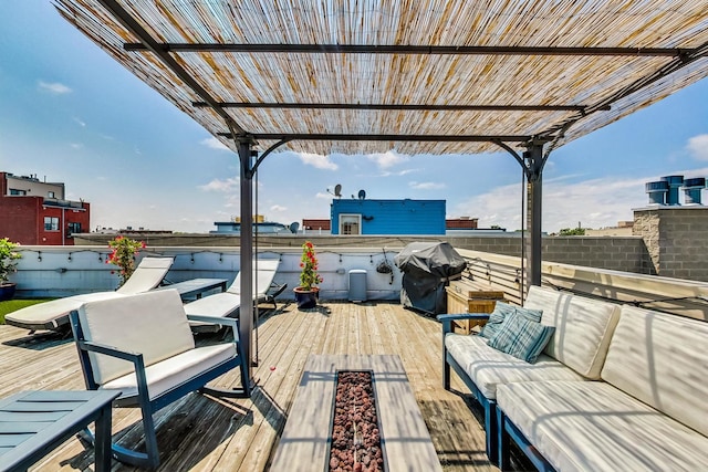 wooden terrace with outdoor lounge area, grilling area, and a pergola