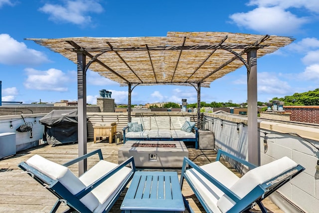 view of patio / terrace with an outdoor living space with a fire pit and a pergola