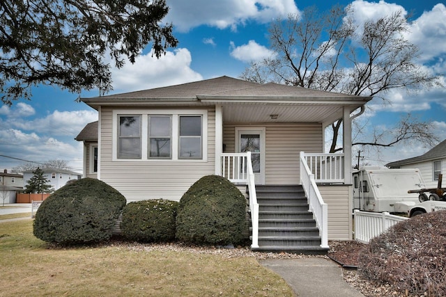 view of front of home featuring a porch and a front yard