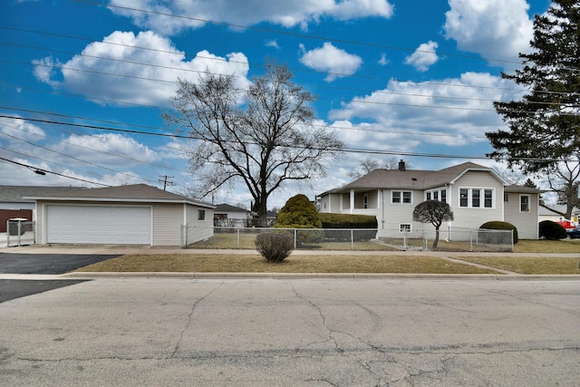 ranch-style house with a garage and a front yard