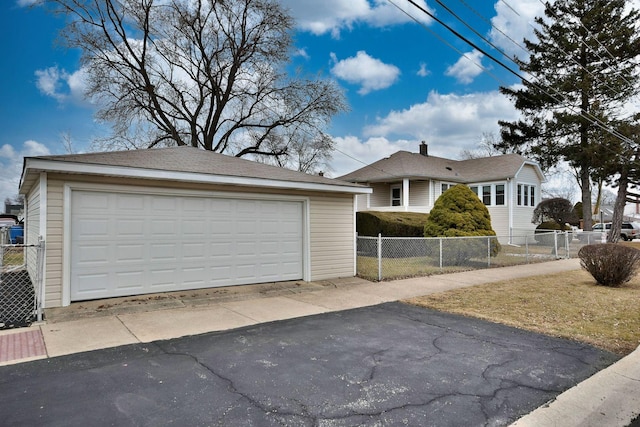 exterior space with an outbuilding and a garage