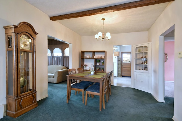 dining room featuring beam ceiling, a chandelier, and dark colored carpet