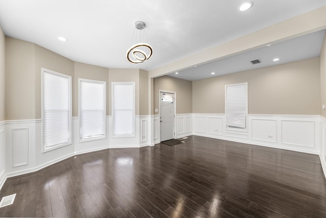 unfurnished room featuring dark hardwood / wood-style flooring