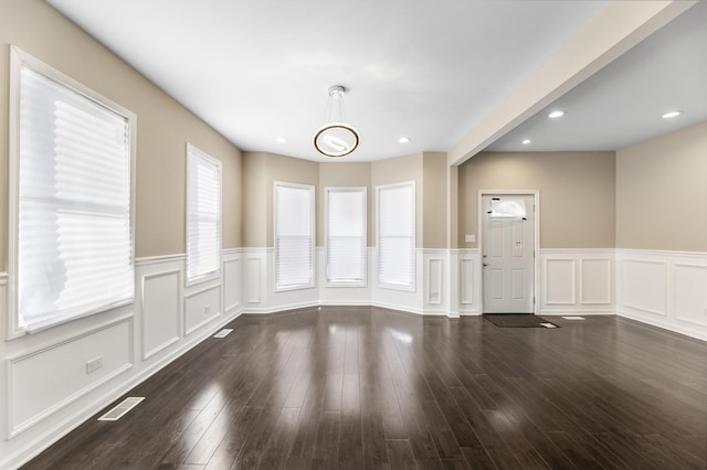 unfurnished room featuring dark wood-type flooring