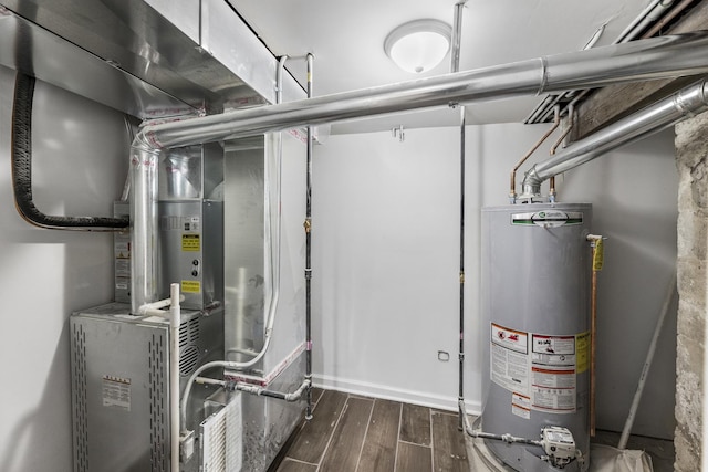 utility room featuring water heater