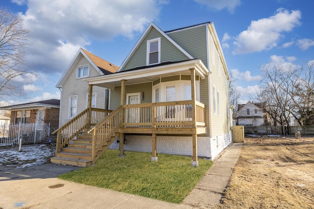 view of front of home featuring a porch and a front lawn