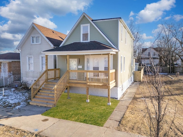 bungalow featuring a porch and a front yard